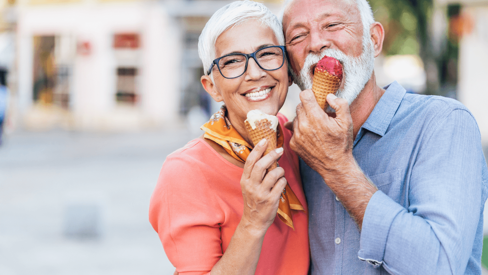 A senior couple enjoying ice cream in the city, showcasing the joy of elderly people in home care